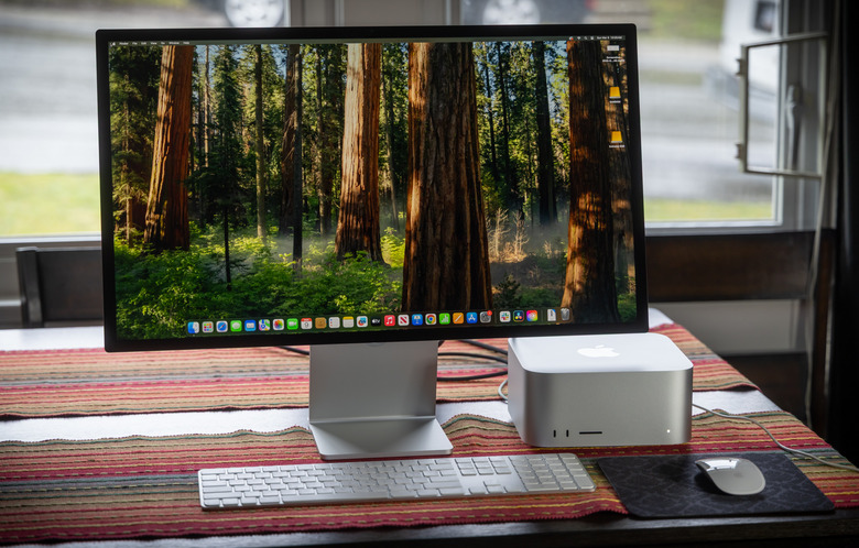 Apple Mac Studio compact desktop workstation placed on a modern setup.