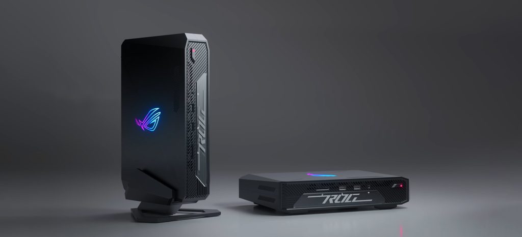 Compact ASUS ROG NUC gaming mini PC standing vertically on a gaming desk.