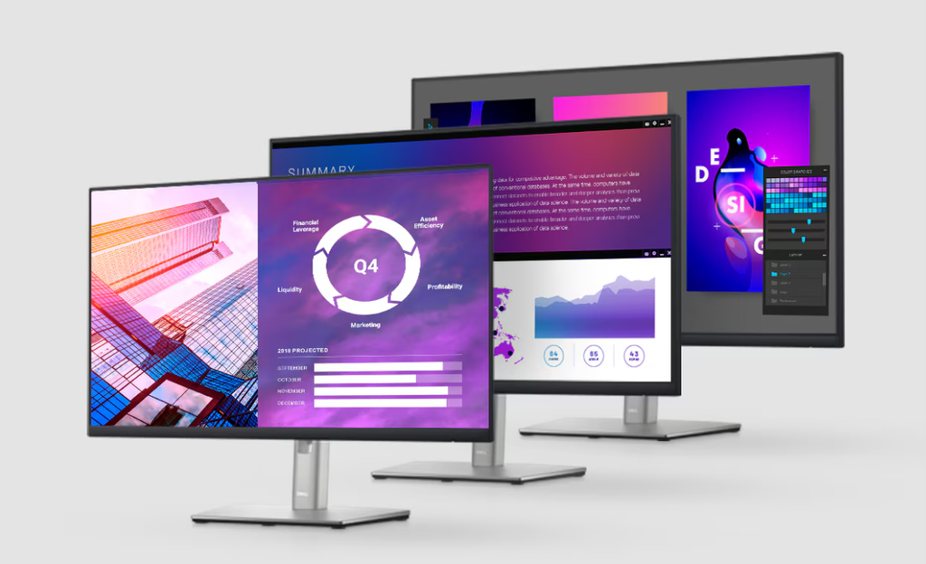 A Dell UltraSharp professional monitor set up on a clean wooden office desk displaying high-resolution color graphics