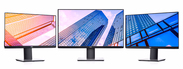 A Dell S Series and P Series professional monitor setup on a clean wooden office desk